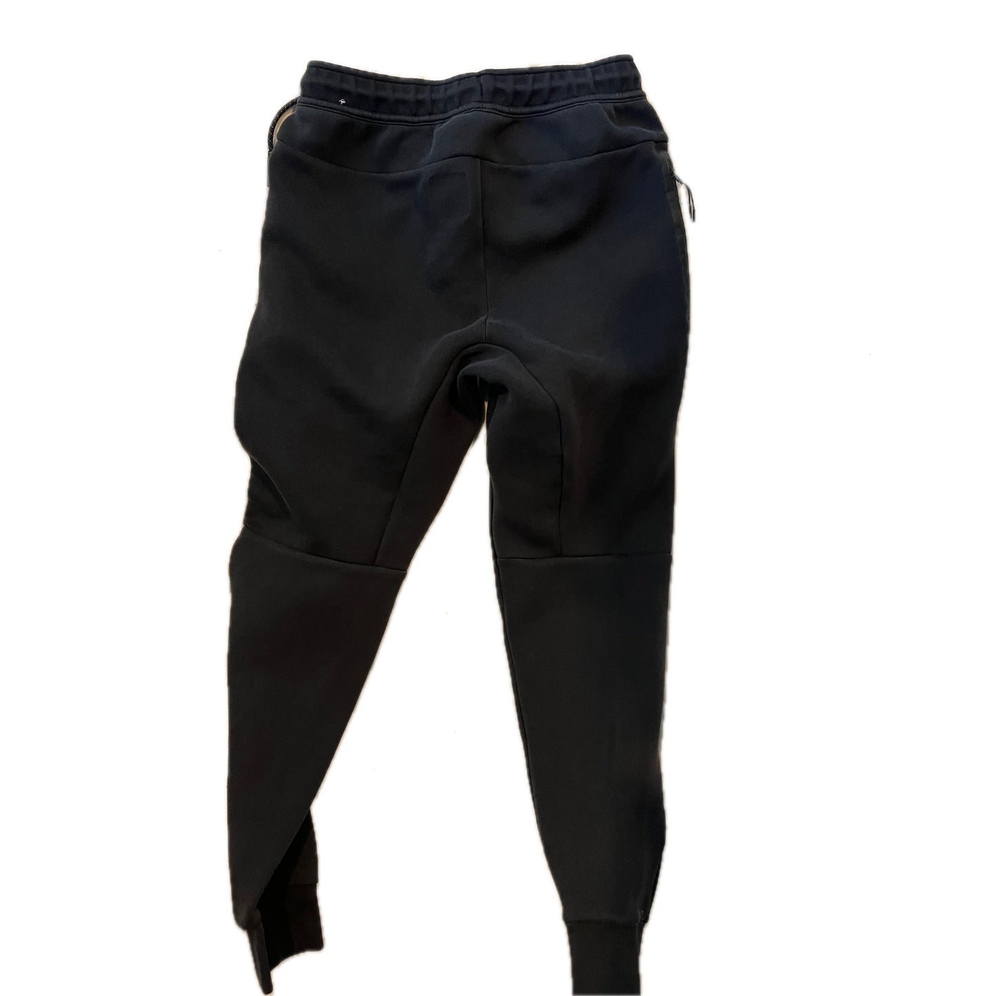 Jogging Nike noir pour homme, coupe décontractée avec chevilles resserrées, taille M.