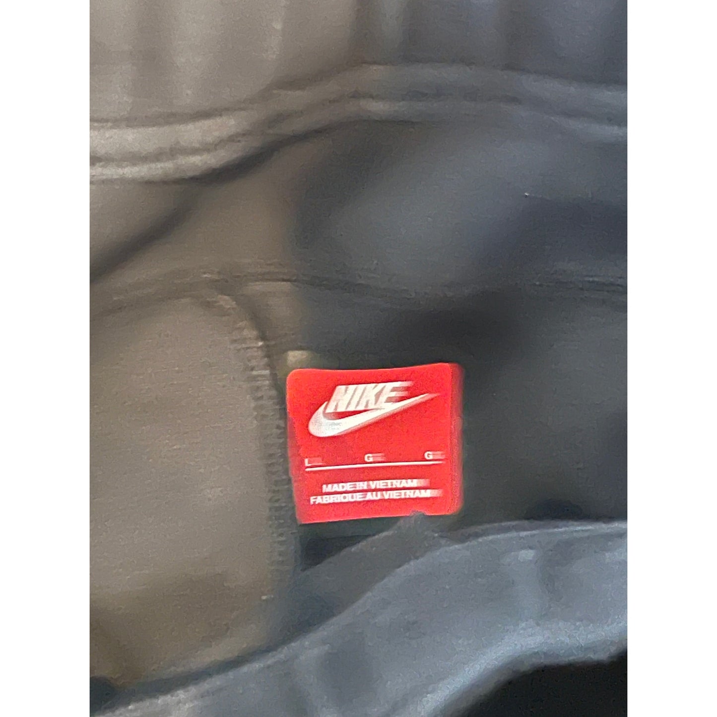 Nike Pantalon de survêtement avec poches zippées et chevilles resserrées Noir Homme Large